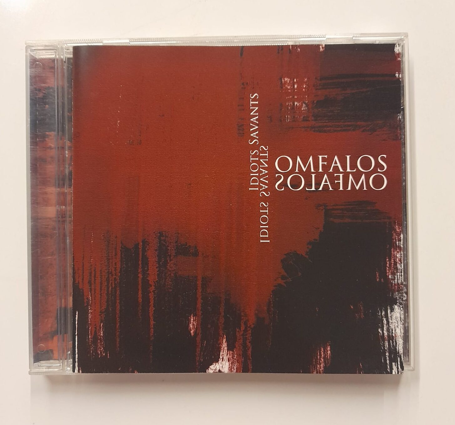 CD Omfalos – Idiots Savants